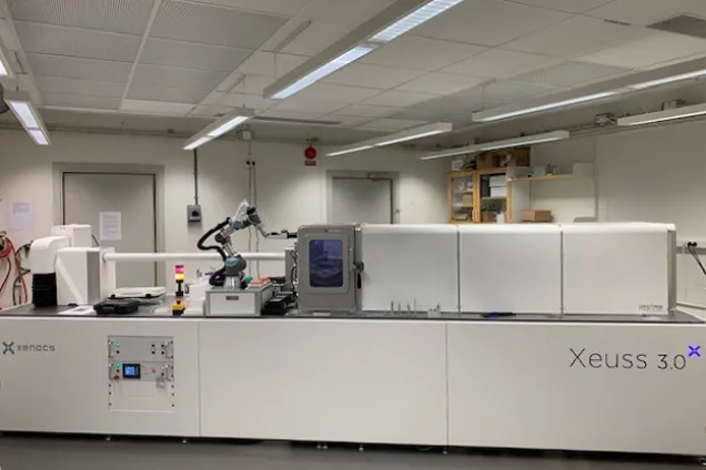 White scientific instrument in a white room. Photo.